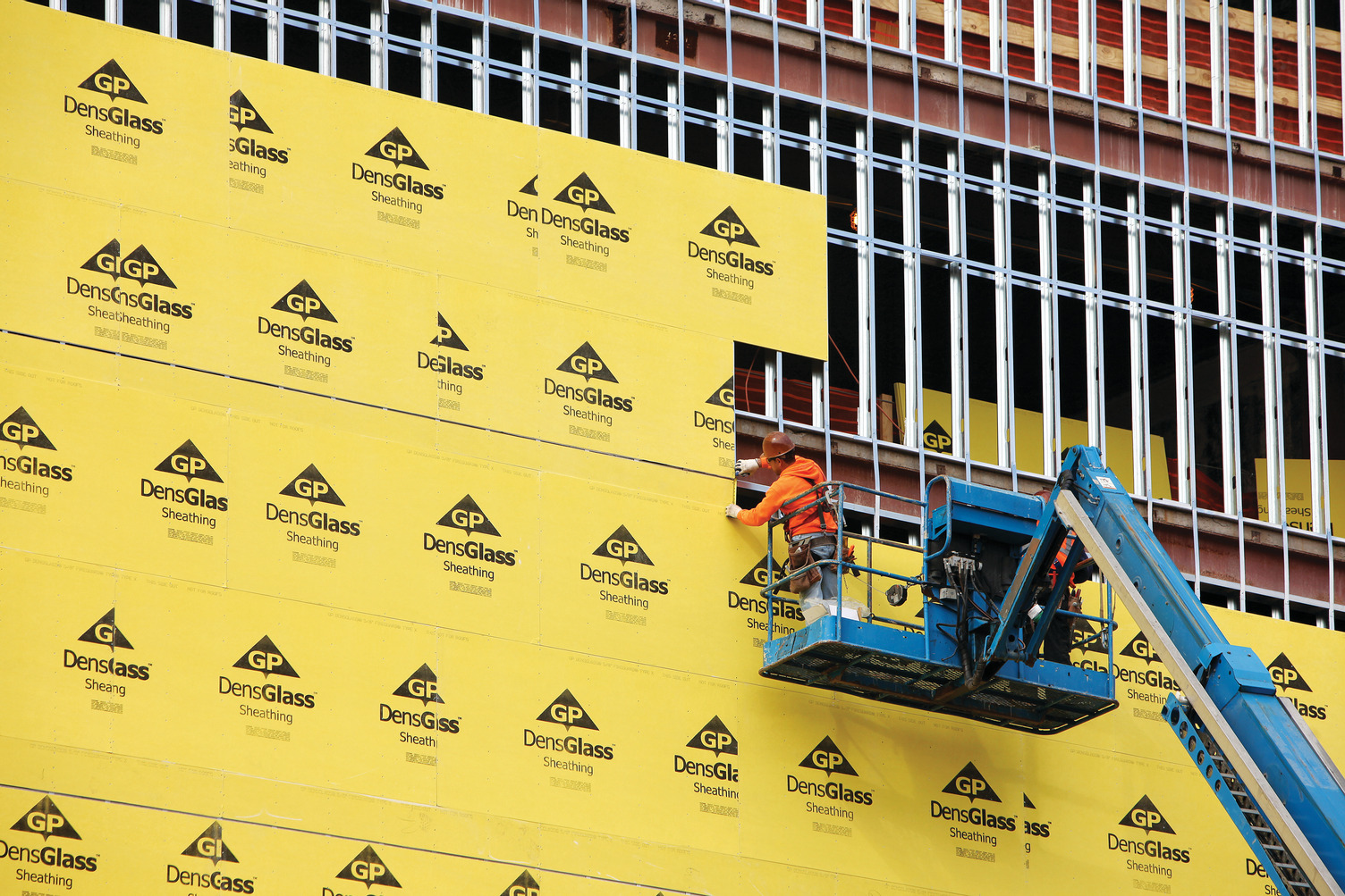 DensGlass Sheathing being installed on a building facade