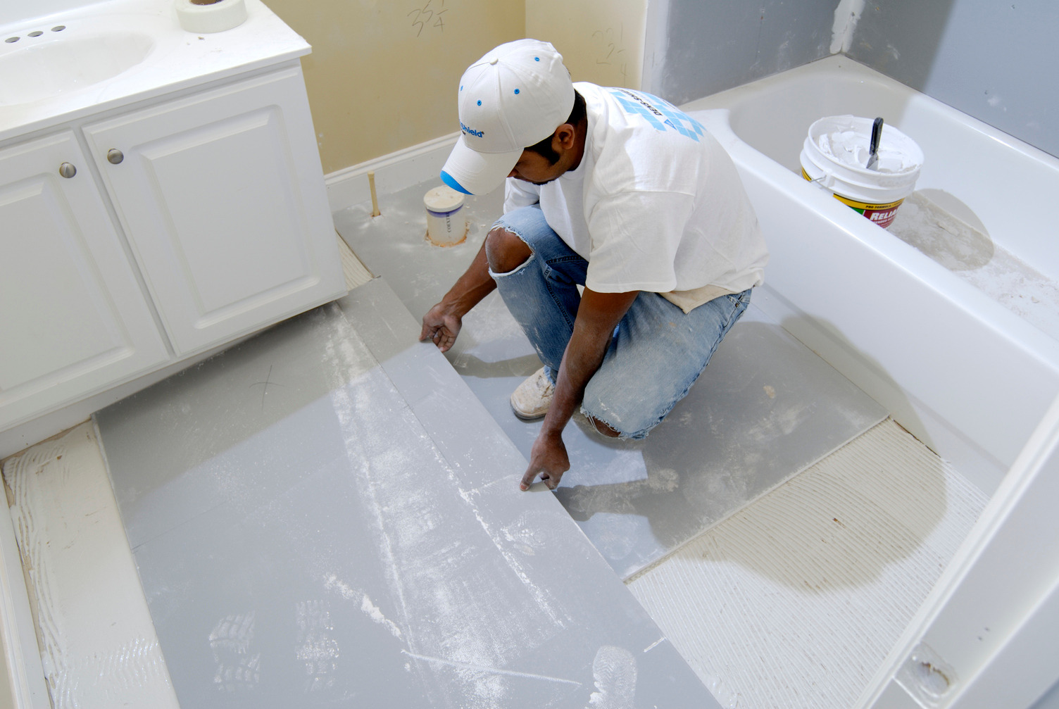 DensSheild Tile Backer being installed on bathroom floor